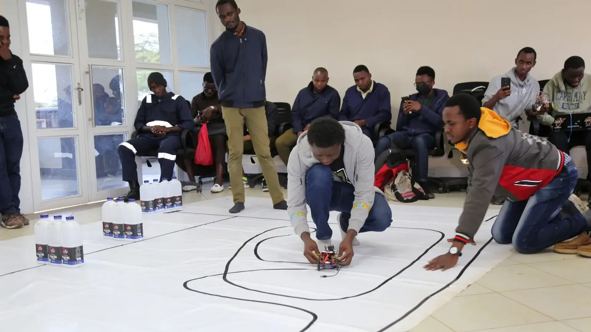 JKUAT students working on robots in the Robotics Dojo